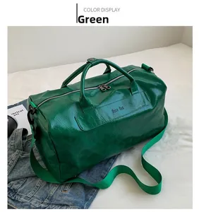 Macro shot of green PU leather travel bag with dual handles and logo detail
