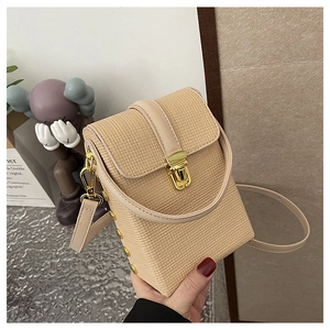 Close-up of beige woven phone bag with leather trim, gold hardware and buckle detail