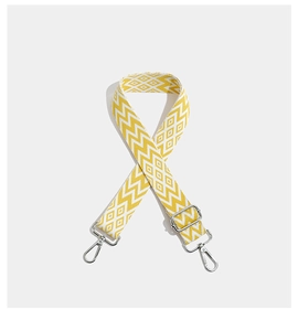 Detail of embroidered geometric yellow strap with silver metal swivel hooks and buckle