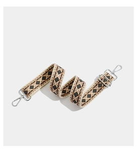 Close-up of geometric embroidered wide strap with silver metal lobster clasps and buckles