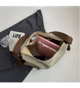 Spacious interior of beige canvas tote bag showing storage for tablet and gadgets