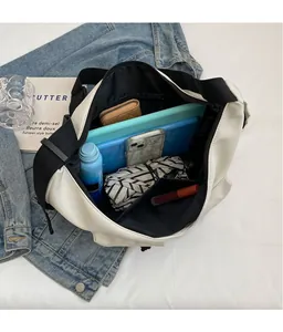 Top view of large canvas tote bag interior showing spacious main compartment and pockets