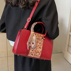 Elegant red PU leather wedding handbag with gold floral motifs and silk scarf decoration
