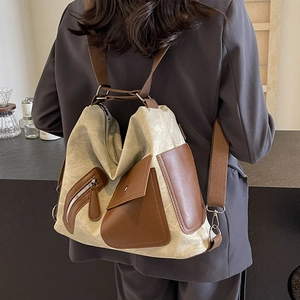Versatile beige canvas and brown leather backpack for women with a vintage aesthetic