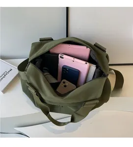 Top view of large nylon tote bag showing spacious interior with tablets and umbrella