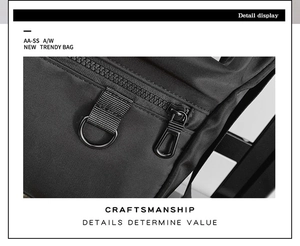 Detail view of smooth resin zipper and reinforced stitching on durable black nylon bag