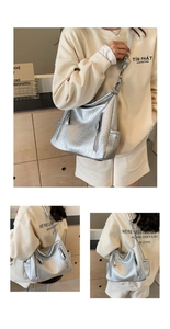 Détail du grand sac cabas argenté avec texture cuir craquelé et poches zippées modernes