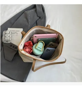 Interior view of large tote bag showing space for tablet, water bottle and phone