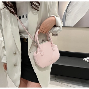 Pink retro doctor bag featuring metal clasp closure and fashion text detail