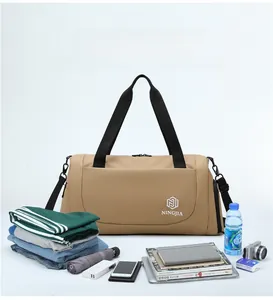 Close-up of large khaki travel bag with NINGJIA logo and organized packing items