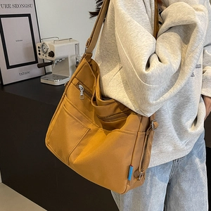 Versatile mustard brown large capacity tote bag with multiple pockets and shoulder straps