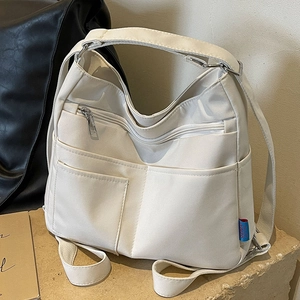 White multi-pocket canvas tote bag with adjustable straps for large capacity commuting