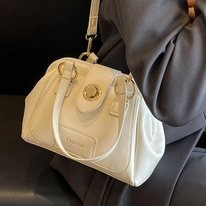 Chic cream Boston shoulder bag with gold hardware and top handle for women