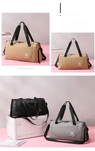 Detail view of khaki, black, and gray versatile travel duffel bags with adjustable straps