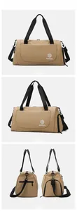 Detail view of khaki large travel duffel bag with dual handles and adjustable shoulder strap