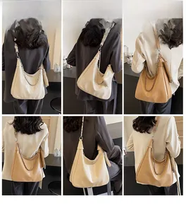 Detailed views of a large Hobo tote bag with chain strap and small pouch worn by a model