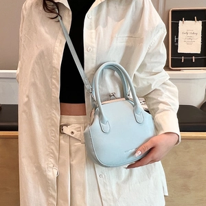 Light blue crossbody handbag with vintage metal clasp and top handle for women