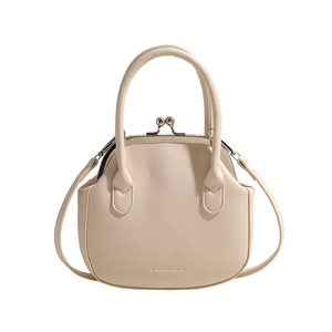 Chic cream white crossbody bag with vintage clip closure and minimalist fashion logo