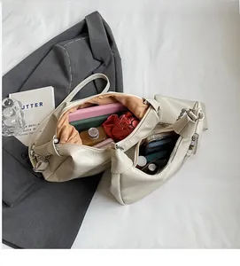 Top view of spacious cream tote bag interior showing capacity for books and daily essentials