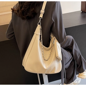 Detail of soft cream PU leather tote with silver chain and matching small coin pouch