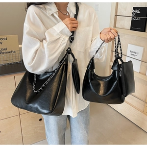 Black leather tote bag and shoulder bag set with silver chain straps and small coin purse