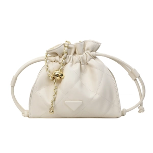 Elegant beige quilted diamond chain bucket bag with gold accents and drawstring closure
