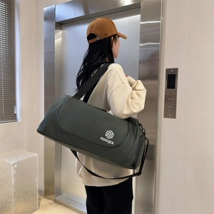 Large dark green travel bag for gym and sports with adjustable shoulder strap and NINGJIA logo
