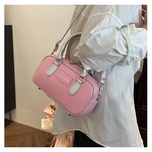 Detail of pink and silver crossbody box bag featuring Fashion & bag logo and metal zipper