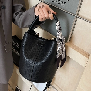 Litchi pattern leather bucket bag with decorative scarf handle and gold hardware