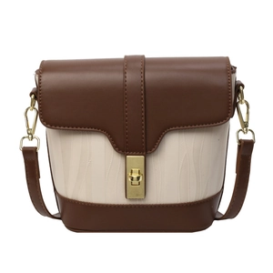 Classic two-tone bucket bag with deep brown leather flap and creamy wave texture body