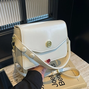 Chic cream white envelope crossbody bag with gold petal buckle and wide rivet strap