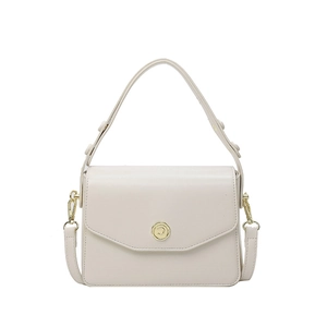 Elegant cream white crossbody handbag with gold hardware and top handle on white background