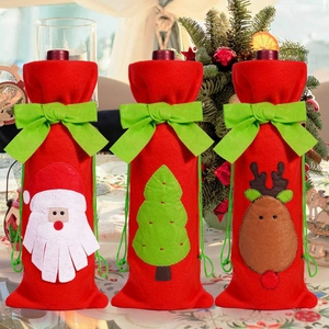 Three-piece Christmas wine bottle covers in red felt with bow ties and embroidery