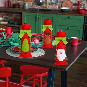 Detailed view of 3-pack Christmas wine bottle covers with Santa, reindeer and tree patterns