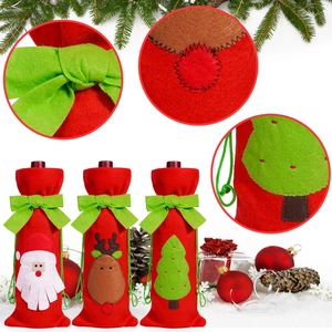 Detailed view of Christmas felt wine bottle covers with holiday embroidery and green bows