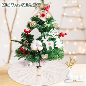 Detail of 24 inch cream knitted Christmas tree skirt with cable knit texture