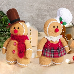 Cute Christmas gingerbread plush dolls with chef hat and festive decor in warm setting