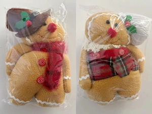 Detailed view of Christmas gingerbread man plush set with festive chef hats and aprons
