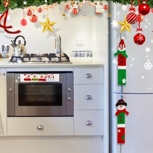 Detailed view of Christmas themed kitchen appliance handle covers with snowman embroidery