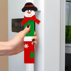 Close-up of 3D snowman refrigerator handle cover with festive red and green patterns