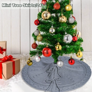 Detailed knit texture of 24 inch grey Christmas tree skirt with decorative cable pattern