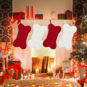 Detailed knit texture of bone-shaped Christmas stockings on a warm fireplace mantel
