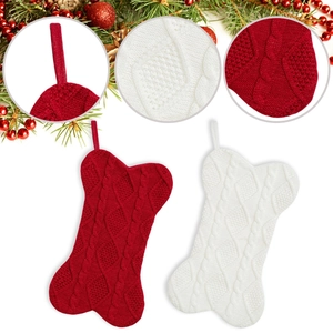 Cable knit bone-shaped Christmas stockings in red and white with hanging loops