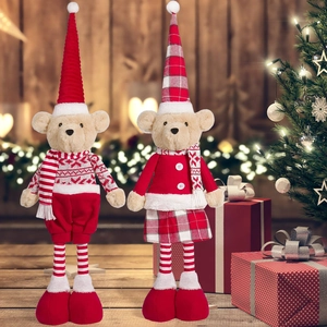 Close-up of Christmas teddy bear plush toys with festive hats and holiday decorations