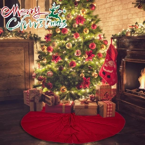 Detail of red cable knit Christmas tree skirt with decorative bow tie closures