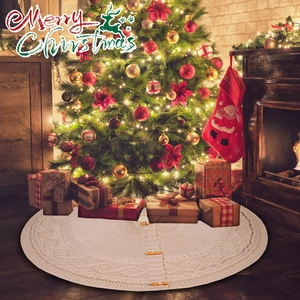 Close-up of beige knit Christmas tree skirt featuring cable pattern and wooden buttons