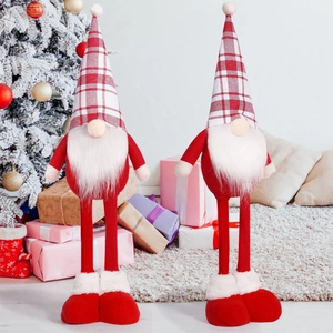 Detailed close-up of two long-legged Christmas gnomes with red and white plaid hats