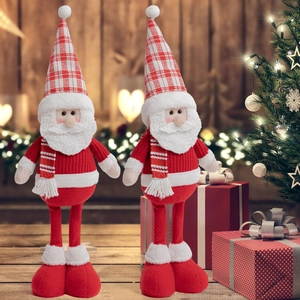 Close-up of standing Santa plush dolls with long legs and cozy red knit sweaters