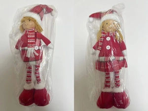 Detailed view of Christmas boy and girl dolls in red plaid outfits and knitted hats