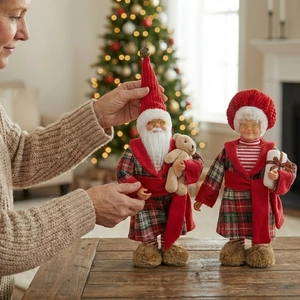 Standing Santa Claus and Mrs Claus plush dolls with festive plaid pajamas for home decor